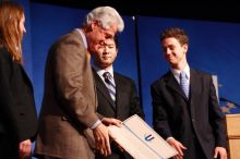 Former President Bill Clinton hands out commitment certificates to CGIU attendees for their exceptional pledges to the CGI cause during the opening plenary session of the CGIU meeting. Day one of the 2nd Annual Clinton Global Initiative University (CGIU) meeting was held at The University of Texas at Austin, Friday, February 13, 2009. Former President Bill Clinton hands out commitment certificates to CGIU attendees for their exceptional pledges to the CGI cause during the opening plenary session of the CGIU meeting. Day one of the 2nd Annual Clinton Global Initiative University (CGIU) meeting was held at The University of Texas at Austin, Friday, February 13, 2009.