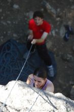 Beth Marek top rope climbing Roo Dog (5.8) with Andrew Dreher belaying, taken from the anchors of the route.  It was Beth's third time outside, and another long day of rock climbing at Seismic Wall on Austin's Barton Creek Greenbelt, Monday, May 25, 2009.