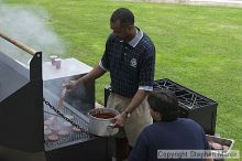 Coach Paul Hewitt and Jimmy Mitchell grill hamburgers at AXO Thursday night.  AXO was the winning sorority for the basketball attendance competition.

Filename: crw_0051_std.jpg
Aperture: f/6.3
Shutter Speed: 1/80
Body: Canon EOS DIGITAL REBEL
Lens: Canon EF 50mm f/1.8 II