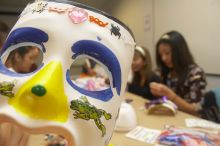 Through the eyes of Rita Saynhalath's mask, from the right, Christine Achico, Diane Nguyen, and Hannah Yee at a domestic violence expressive arts workshop for survivors and friends of survivors of domestic and relationship violence.
Filename: SRM_20061023_1810228.jpg
Aperture: f/5.6
Shutter Speed: 1/100
Body: Canon EOS 20D
Lens: Canon EF-S 18-55mm f/3.5-5.6