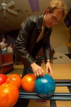 Blake Lindell reaches for a bowling ball.  Alpha Xi Delta held a sock hop themed date night at the Austin 300 bowling alley, Thursday night, March 29, 2007.

Filename: SRM_20070329_2022022.jpg
Aperture: f/8.0
Shutter Speed: 1/200
Body: Canon EOS-1D Mark II
Lens: Sigma 15-30mm f/3.5-4.5 EX Aspherical DG DF