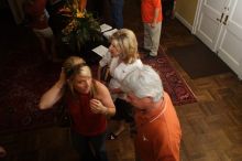 Elizabeth Clinch and her parents.  Kappa Kappa Gamma (KKG) hosted a parents' weekend barbecue before the UT vs Nebraska football game on Saturday, October 27, 2007 at their sorority house.

Filename: SRM_20071027_1155147.jpg
Aperture: f/8.0
Shutter Speed: 1/250
Body: Canon EOS 20D
Lens: Canon EF-S 18-55mm f/3.5-5.6