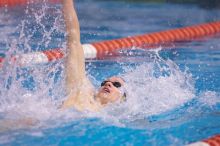 UT senior Matthew McGinnis took first in the 200 yard backstroke with a time of 1:47.37.  The University of Texas Longhorns defeated The University of Georgia Bulldogs 157-135 on Saturday, January 12, 2008.

Filename: SRM_20080112_1158386.jpg
Aperture: f/2.8
Shutter Speed: 1/400
Body: Canon EOS-1D Mark II
Lens: Canon EF 300mm f/2.8 L IS