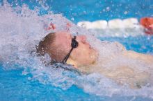 UT senior Matthew McGinnis took first in the 200 yard backstroke with a time of 1:47.37.  The University of Texas Longhorns defeated The University of Georgia Bulldogs 157-135 on Saturday, January 12, 2008.

Filename: SRM_20080112_1158481.jpg
Aperture: f/2.8
Shutter Speed: 1/400
Body: Canon EOS-1D Mark II
Lens: Canon EF 300mm f/2.8 L IS