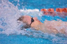 UT senior Matthew McGinnis took first in the 200 yard backstroke with a time of 1:47.37.  The University of Texas Longhorns defeated The University of Georgia Bulldogs 157-135 on Saturday, January 12, 2008.

Filename: SRM_20080112_1158543.jpg
Aperture: f/2.8
Shutter Speed: 1/400
Body: Canon EOS-1D Mark II
Lens: Canon EF 300mm f/2.8 L IS