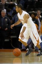 UT junior A.J. Abrams (#3, G) playing defense against a Kansas player.  The University of Texas (UT) Longhorns defeated the University of Kansas Jayhawks 72-69 in Austin, Texas on Monday, February 11, 2008.

Filename: SRM_20080211_2016164.jpg
Aperture: f/2.8
Shutter Speed: 1/640
Body: Canon EOS 20D
Lens: Canon EF 300mm f/2.8 L IS