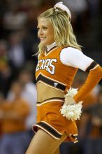 Texas cheerleader.  The University of Texas (UT) Longhorns defeated the University of Kansas Jayhawks 72-69 in Austin, Texas on Monday, February 11, 2008.

Filename: SRM_20080211_2148562.jpg
Aperture: f/2.8
Shutter Speed: 1/640
Body: Canon EOS 20D
Lens: Canon EF 300mm f/2.8 L IS