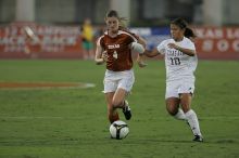 UT senior Jill Gilbeau (#4, Defender and Midfielder).  The University of Texas women's soccer team tied 0-0 against the Texas A&M Aggies Friday night, September 27, 2008.

Filename: SRM_20080926_1922227.jpg
Aperture: f/4.0
Shutter Speed: 1/500
Body: Canon EOS-1D Mark II
Lens: Canon EF 300mm f/2.8 L IS