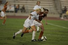 UT junior Emily Anderson (#21, Forward) plays defense on A&M #33.  The University of Texas women's soccer team tied 0-0 against the Texas A&M Aggies Friday night, September 27, 2008.

Filename: SRM_20080926_2027424.jpg
Aperture: f/2.8
Shutter Speed: 1/640
Body: Canon EOS-1D Mark II
Lens: Canon EF 300mm f/2.8 L IS