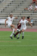 UT freshman Lucy Keith (#6, Midfielder) and UT senior Kasey Moore (#14, Defender) rush to the ball.  The University of Texas women's soccer team won 2-1 against the Iowa State Cyclones Sunday afternoon, October 5, 2008.

Filename: SRM_20081005_12022811.jpg
Aperture: f/5.6
Shutter Speed: 1/1600
Body: Canon EOS-1D Mark II
Lens: Canon EF 300mm f/2.8 L IS