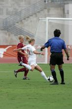 UT sophomore Niki Arlitt (#11, Forward) takes a shot on goal.  The University of Texas women's soccer team won 2-1 against the Iowa State Cyclones Sunday afternoon, October 5, 2008.

Filename: SRM_20081005_12040627.jpg
Aperture: f/5.6
Shutter Speed: 1/1600
Body: Canon EOS-1D Mark II
Lens: Canon EF 300mm f/2.8 L IS