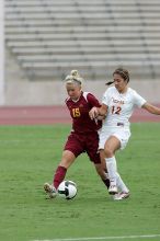 UT sophomore Alisha Ortiz (#12, Forward) fights for the ball.  The University of Texas women's soccer team won 2-1 against the Iowa State Cyclones Sunday afternoon, October 5, 2008.

Filename: SRM_20081005_12042234.jpg
Aperture: f/5.6
Shutter Speed: 1/1250
Body: Canon EOS-1D Mark II
Lens: Canon EF 300mm f/2.8 L IS