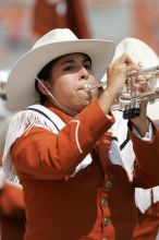 The UT marching band takes the field before the Arkansas football game.  The University of Texas football team defeated the Arkansas Razorbacks with a score of 52-10 in Austin, TX on Saturday, September 27, 2008.

Filename: SRM_20080927_14204639.jpg
Aperture: f/5.6
Shutter Speed: 1/1250
Body: Canon EOS-1D Mark II
Lens: Canon EF 300mm f/2.8 L IS