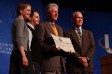 Former President Bill Clinton hands out commitment certificates to CGIU attendees for their exceptional pledges to the CGI cause during the opening plenary session of the CGIU meeting.  Day one of the 2nd Annual Clinton Global Initiative University (CGIU) meeting was held at The University of Texas at Austin, Friday, February 13, 2009.

Filename: SRM_20090213_16505889.jpg
Aperture: f/4.0
Shutter Speed: 1/250
Body: Canon EOS-1D Mark II
Lens: Canon EF 80-200mm f/2.8 L