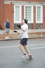 Barry Goldmeier, bib #16608 (8K) and  #5587 (marathon) juggling and running the 8K at the Richmond SunTrust Marathon and McDonald's Half Marathon, on Saturday, November 14, 2009.

Filename: SRM_20091114_07573369.JPG
Aperture: f/2.8
Shutter Speed: 1/320
Body: Canon EOS-1D Mark II
Lens: Canon EF 80-200mm f/2.8 L