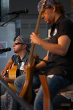 The Gene Pool, performing at the Austin airport.  Geno Stroia II on vocals/guitar, Jorge Castillo on vocals/guitar, Travis Woodard on drums and Steven Ray Will on vocals/bass guitar.

Filename: SRM_20060518_154804_8.jpg
Aperture: f/2.8
Shutter Speed: 1/200
Body: Canon EOS 20D
Lens: Canon EF 80-200mm f/2.8 L