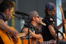 The Gene Pool, performing at the Austin airport.  Geno Stroia II on vocals/guitar, Jorge Castillo on vocals/guitar, Travis Woodard on drums and Steven Ray Will on vocals/bass guitar.

Filename: SRM_20060518_155006_5.jpg
Aperture: f/2.8
Shutter Speed: 1/200
Body: Canon EOS 20D
Lens: Canon EF 80-200mm f/2.8 L