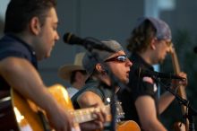 The Gene Pool, performing at the Austin airport.  Geno Stroia II on vocals/guitar, Jorge Castillo on vocals/guitar, Travis Woodard on drums and Steven Ray Will on vocals/bass guitar.

Filename: SRM_20060518_155048_8.jpg
Aperture: f/2.8
Shutter Speed: 1/200
Body: Canon EOS 20D
Lens: Canon EF 80-200mm f/2.8 L