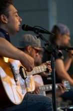 The Gene Pool, performing at the Austin airport.  Geno Stroia II on vocals/guitar, Jorge Castillo on vocals/guitar, Travis Woodard on drums and Steven Ray Will on vocals/bass guitar.

Filename: SRM_20060518_155446_0.jpg
Aperture: f/2.8
Shutter Speed: 1/250
Body: Canon EOS 20D
Lens: Canon EF 80-200mm f/2.8 L