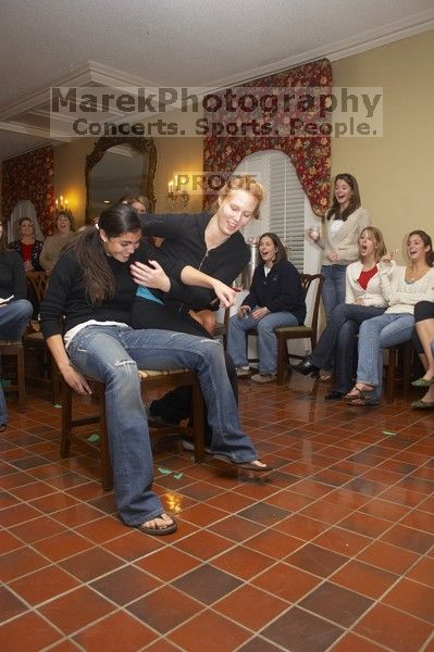 Christina Ramirez and Brittney Hibbs battle it out for first place in musical chairs at the Alpha Delta Pi Christmas party, Sunday, December 10, 2006.  Christina won.

Filename: SRM_20061210_1817401.jpg
Aperture: f/5.0
Shutter Speed: 1/100
Body: Canon EOS 20D
Lens: Canon EF-S 18-55mm f/3.5-5.6