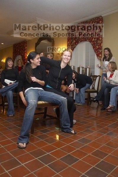 Christina Ramirez and Brittney Hibbs battle it out for first place in musical chairs at the Alpha Delta Pi Christmas party, Sunday, December 10, 2006.  Christina won.

Filename: SRM_20061210_1817422.jpg
Aperture: f/5.0
Shutter Speed: 1/100
Body: Canon EOS 20D
Lens: Canon EF-S 18-55mm f/3.5-5.6