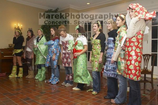 Modeling their wrapping paper outfits at the Alpha Delta Pi Christmas party, Sunday, December 10, 2006.

Filename: SRM_20061210_1843388.jpg
Aperture: f/7.1
Shutter Speed: 1/100
Body: Canon EOS 20D
Lens: Canon EF-S 18-55mm f/3.5-5.6