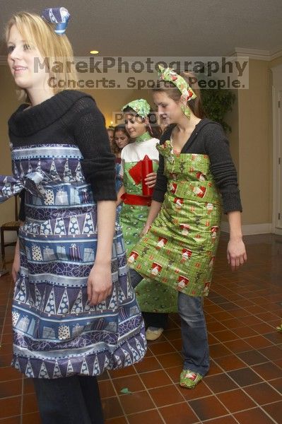 Modeling their wrapping paper outfits at the Alpha Delta Pi Christmas party, Sunday, December 10, 2006.

Filename: SRM_20061210_1843569.jpg
Aperture: f/7.1
Shutter Speed: 1/100
Body: Canon EOS 20D
Lens: Canon EF-S 18-55mm f/3.5-5.6