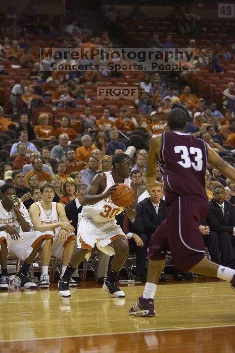 The longhorns defeated the Texas Southern University (TSU) Tigers 90-50 Tuesday night.

Filename: SRM_20061128_2038466.jpg
Aperture: f/2.8
Shutter Speed: 1/640
Body: Canon EOS-1D Mark II
Lens: Canon EF 80-200mm f/2.8 L