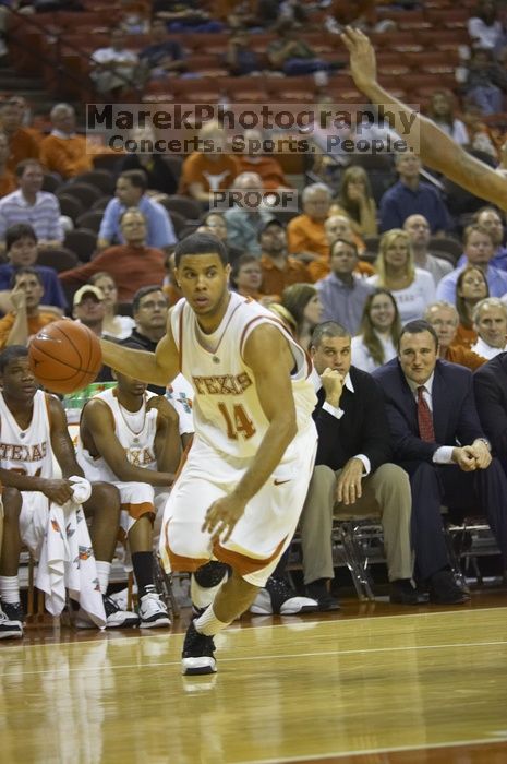 Guard D.J. Augustin, #14.  The longhorns defeated the Texas Southern University (TSU) Tigers 90-50 Tuesday night.

Filename: SRM_20061128_2044083.jpg
Aperture: f/2.8
Shutter Speed: 1/640
Body: Canon EOS-1D Mark II
Lens: Canon EF 80-200mm f/2.8 L