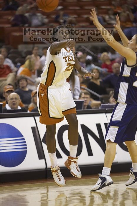 The lady longhorns defeated the Oral Roberts University's (ORU) Golden Eagles 79-40 Saturday night.

Filename: SRM_20061125_1400504.jpg
Aperture: f/2.8
Shutter Speed: 1/400
Body: Canon EOS-1D Mark II
Lens: Canon EF 80-200mm f/2.8 L