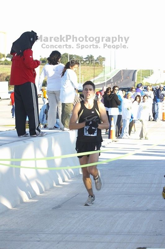 John Keane, bib #1622, placed first with a time of 54:07 at The Girl Scout Scenic 10 Miler road race, Sunday, October 22, 2006.

Filename: SRM_20061022_0848520.jpg
Aperture: f/5.0
Shutter Speed: 1/160
Body: Canon EOS 20D
Lens: Canon EF 80-200mm f/2.8 L