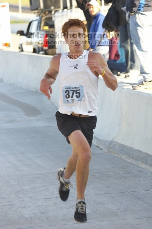 Scott Kimbell, bib #375, placed sixth overall, second in his class, with a time of 57:09 at The Girl Scout Scenic 10 Miler road race, Sunday, October 22, 2006.

Filename: SRM_20061022_0851546.jpg
Aperture: f/4.5
Shutter Speed: 1/250
Body: Canon EOS 20D
Lens: Canon EF 80-200mm f/2.8 L