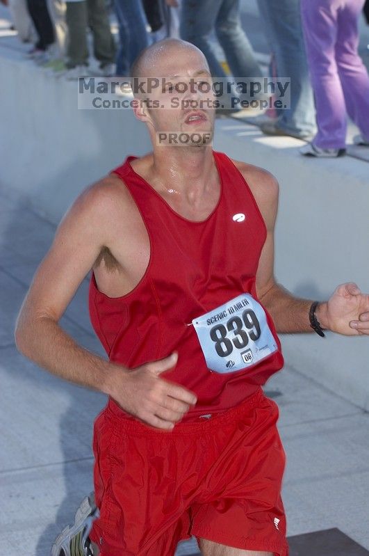 Doug Framke, bib #839, with a time of 59:24 at The Girl Scout Scenic 10 Miler road race, Sunday, October 22, 2006.

Filename: SRM_20061022_0854108.jpg
Aperture: f/4.5
Shutter Speed: 1/250
Body: Canon EOS 20D
Lens: Canon EF 80-200mm f/2.8 L