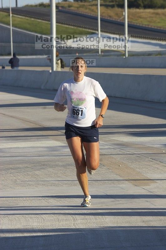 Nora Colligan, bib #661, placed second for the women with a time of 1:03:50 at The Girl Scout Scenic 10 Miler road race, Sunday, October 22, 2006.

Filename: SRM_20061022_0858369.jpg
Aperture: f/10.0
Shutter Speed: 1/250
Body: Canon EOS 20D
Lens: Canon EF 80-200mm f/2.8 L