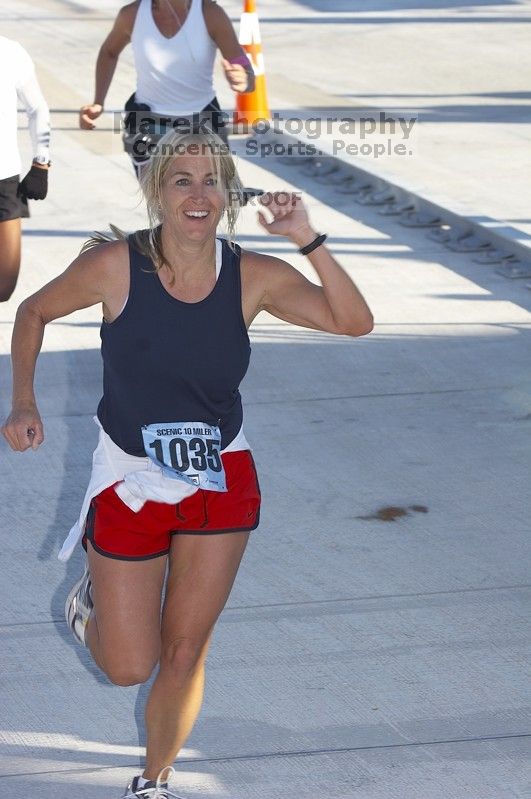 Marilyn Fisher, bib #1035, with a time of 1:19:30 at The Girl Scout Scenic 10 Miler road race, Sunday, October 22, 2006.

Filename: SRM_20061022_0914125.jpg
Aperture: f/7.1
Shutter Speed: 1/250
Body: Canon EOS 20D
Lens: Canon EF 80-200mm f/2.8 L