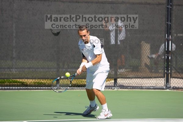 Texas' Dimitar Kutrovsky defeated Tech's Jose Muguruza 6-2 and 6-3.  The University of Texas (UT) men's tennis team defeated Georgia Tech (GT) Saturday, February 24, 2007..

Filename: SRM_20070224_1411525.jpg
Aperture: f/4.0
Shutter Speed: 1/2000
Body: Canon EOS-1D Mark II
Lens: Canon EF 80-200mm f/2.8 L