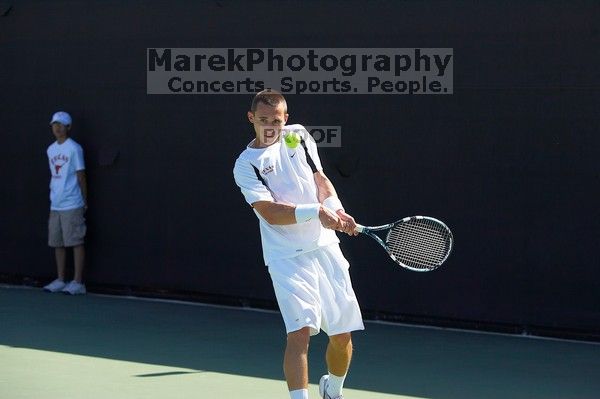 Texas' Dimitar Kutrovsky defeated Tech's Jose Muguruza 6-2 and 6-3.  The University of Texas (UT) men's tennis team defeated Georgia Tech (GT) Saturday, February 24, 2007..

Filename: SRM_20070224_1419222.jpg
Aperture: f/4.0
Shutter Speed: 1/3200
Body: Canon EOS-1D Mark II
Lens: Canon EF 80-200mm f/2.8 L