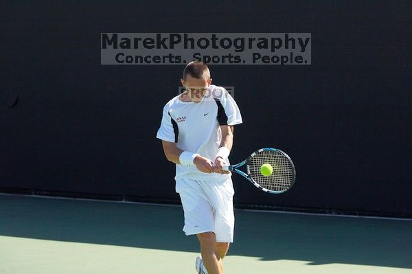 Texas' Dimitar Kutrovsky defeated Tech's Jose Muguruza 6-2 and 6-3.  The University of Texas (UT) men's tennis team defeated Georgia Tech (GT) Saturday, February 24, 2007..

Filename: SRM_20070224_1419286.jpg
Aperture: f/4.0
Shutter Speed: 1/3200
Body: Canon EOS-1D Mark II
Lens: Canon EF 80-200mm f/2.8 L