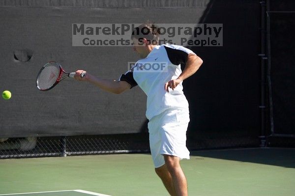 Milan Mihailovic (UT) defeated Jordan DeLass (GT) 6-4, 6-4.  The University of Texas (UT) men's tennis team defeated Georgia Tech (GT) Saturday, February 24, 2007..

Filename: SRM_20070224_1443445.jpg
Aperture: f/4.0
Shutter Speed: 1/8000
Body: Canon EOS-1D Mark II
Lens: Canon EF 80-200mm f/2.8 L