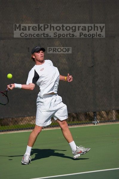 Rook Schellenberg (UT) defeated George Gvelesiani (GT) 6-3, 7-6.  The University of Texas (UT) men's tennis team defeated Georgia Tech (GT) Saturday, February 24, 2007..

Filename: SRM_20070224_1512107.jpg
Aperture: f/4.0
Shutter Speed: 1/4000
Body: Canon EOS-1D Mark II
Lens: Canon EF 80-200mm f/2.8 L