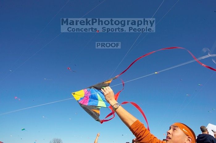 Chris Lam attempts to fly his UT kite at the 79th annual Zilker Park Kite Festival, Sunday, March 4, 2007.

Filename: SRM_20070304_1532103.jpg
Aperture: f/11.0
Shutter Speed: 1/250
Body: Canon EOS-1D Mark II
Lens: Sigma 15-30mm f/3.5-4.5 EX Aspherical DG DF