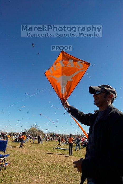 Madhav Tadikonda, class of 1997, and Anjali Patel, class of 1999, fly a UT kite at the 79th annual Zilker Park Kite Festival, Sunday, March 4, 2007.

Filename: SRM_20070304_1536547.jpg
Aperture: f/11.0
Shutter Speed: 1/250
Body: Canon EOS-1D Mark II
Lens: Sigma 15-30mm f/3.5-4.5 EX Aspherical DG DF