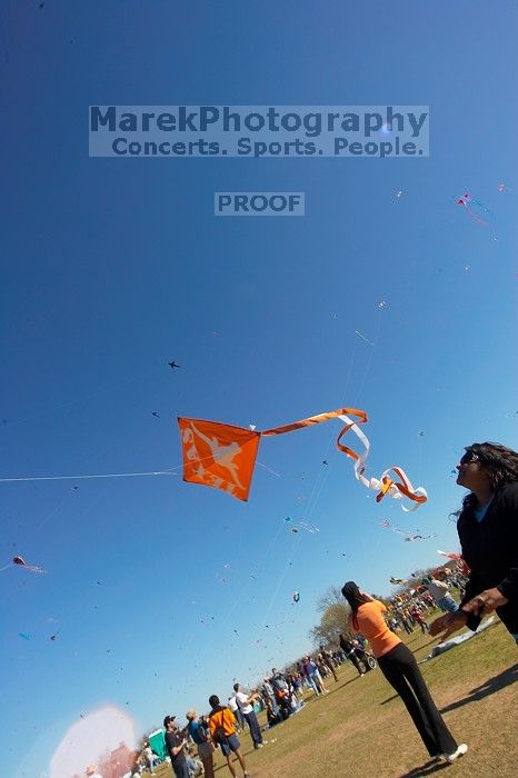 Madhav Tadikonda, class of 1997, and Anjali Patel, class of 1999, fly a UT kite at the 79th annual Zilker Park Kite Festival, Sunday, March 4, 2007.

Filename: SRM_20070304_1538263.jpg
Aperture: f/11.0
Shutter Speed: 1/250
Body: Canon EOS-1D Mark II
Lens: Sigma 15-30mm f/3.5-4.5 EX Aspherical DG DF