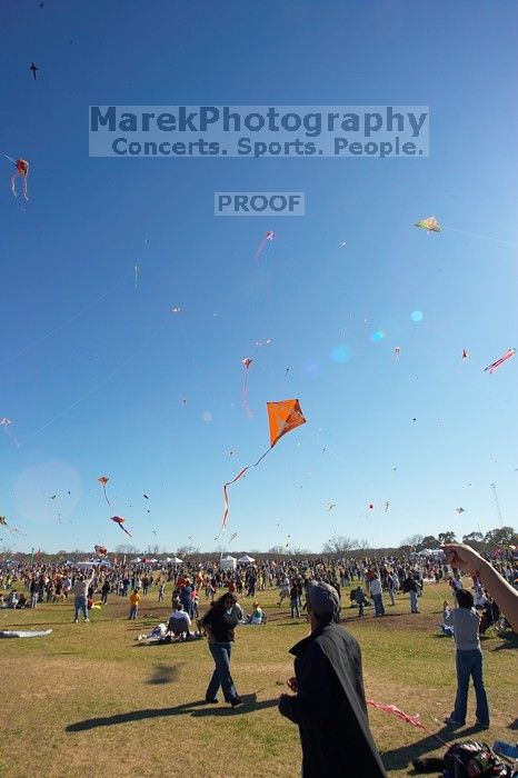 Madhav Tadikonda, class of 1997, and Anjali Patel, class of 1999, fly a UT kite at the 79th annual Zilker Park Kite Festival, Sunday, March 4, 2007.

Filename: SRM_20070304_1540345.jpg
Aperture: f/11.0
Shutter Speed: 1/250
Body: Canon EOS-1D Mark II
Lens: Sigma 15-30mm f/3.5-4.5 EX Aspherical DG DF