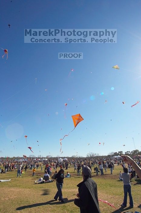 Madhav Tadikonda, class of 1997, and Anjali Patel, class of 1999, fly a UT kite at the 79th annual Zilker Park Kite Festival, Sunday, March 4, 2007.

Filename: SRM_20070304_1540366.jpg
Aperture: f/11.0
Shutter Speed: 1/250
Body: Canon EOS-1D Mark II
Lens: Sigma 15-30mm f/3.5-4.5 EX Aspherical DG DF