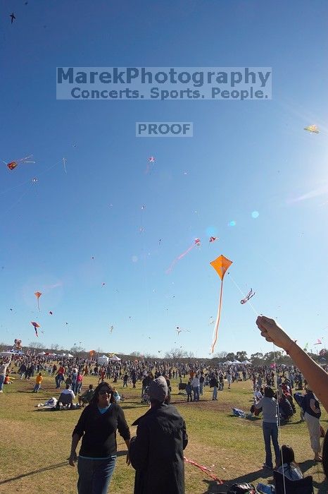 Madhav Tadikonda, class of 1997, and Anjali Patel, class of 1999, fly a UT kite at the 79th annual Zilker Park Kite Festival, Sunday, March 4, 2007.

Filename: SRM_20070304_1540422.jpg
Aperture: f/11.0
Shutter Speed: 1/250
Body: Canon EOS-1D Mark II
Lens: Sigma 15-30mm f/3.5-4.5 EX Aspherical DG DF