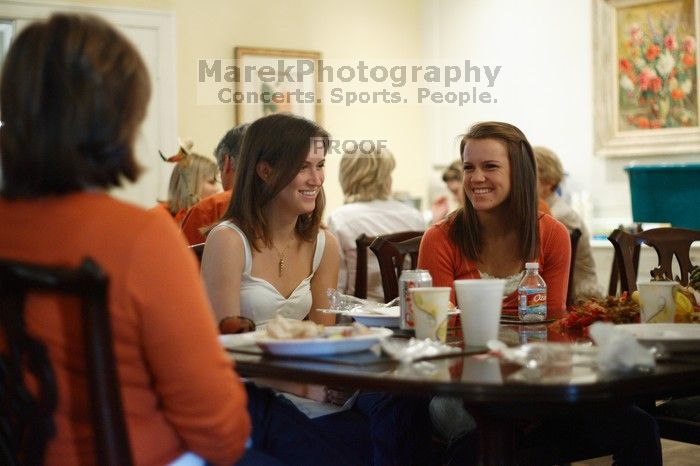 Hannah Koeijmans (in white), Madeline Koeijmans (in red), Grace Koeijmans (in brown and orange) and their parents.  Kappa Kappa Gamma (KKG) hosted a parents' weekend barbecue before the UT vs Nebraska football game on Saturday, October 27, 2007 at their so

Filename: SRM_20071027_1150469.jpg
Aperture: f/1.8
Shutter Speed: 1/50
Body: Canon EOS-1D Mark II
Lens: Canon EF 50mm f/1.8 II