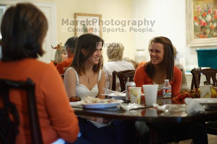 Hannah Koeijmans (in white), Madeline Koeijmans (in red), Grace Koeijmans (in brown and orange) and their parents.  Kappa Kappa Gamma (KKG) hosted a parents' weekend barbecue before the UT vs Nebraska football game on Saturday, October 27, 2007 at their so

Filename: SRM_20071027_1150480.jpg
Aperture: f/1.8
Shutter Speed: 1/60
Body: Canon EOS-1D Mark II
Lens: Canon EF 50mm f/1.8 II