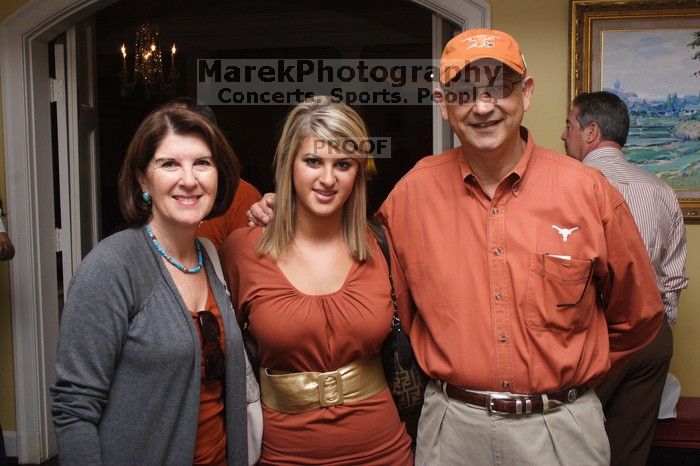 Maggie Hines and her parents.  Kappa Kappa Gamma (KKG) hosted a parents' weekend barbecue before the UT vs Nebraska football game on Saturday, October 27, 2007 at their sorority house.

Filename: SRM_20071027_1157120.jpg
Aperture: f/8.0
Shutter Speed: 1/250
Body: Canon EOS 20D
Lens: Canon EF-S 18-55mm f/3.5-5.6