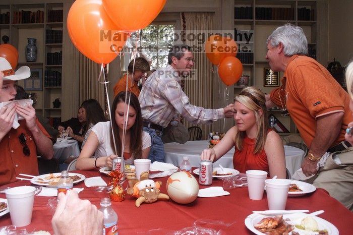 Jill Swanson and her brother, left, with Elizabeth Clinch, right.  Kappa Kappa Gamma (KKG) hosted a parents' weekend barbecue before the UT vs Nebraska football game on Saturday, October 27, 2007 at their sorority house.

Filename: SRM_20071027_1209241.jpg
Aperture: f/8.0
Shutter Speed: 1/250
Body: Canon EOS 20D
Lens: Canon EF-S 18-55mm f/3.5-5.6